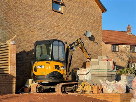 can a mini digger fit through a gate|mini digger hire cost.